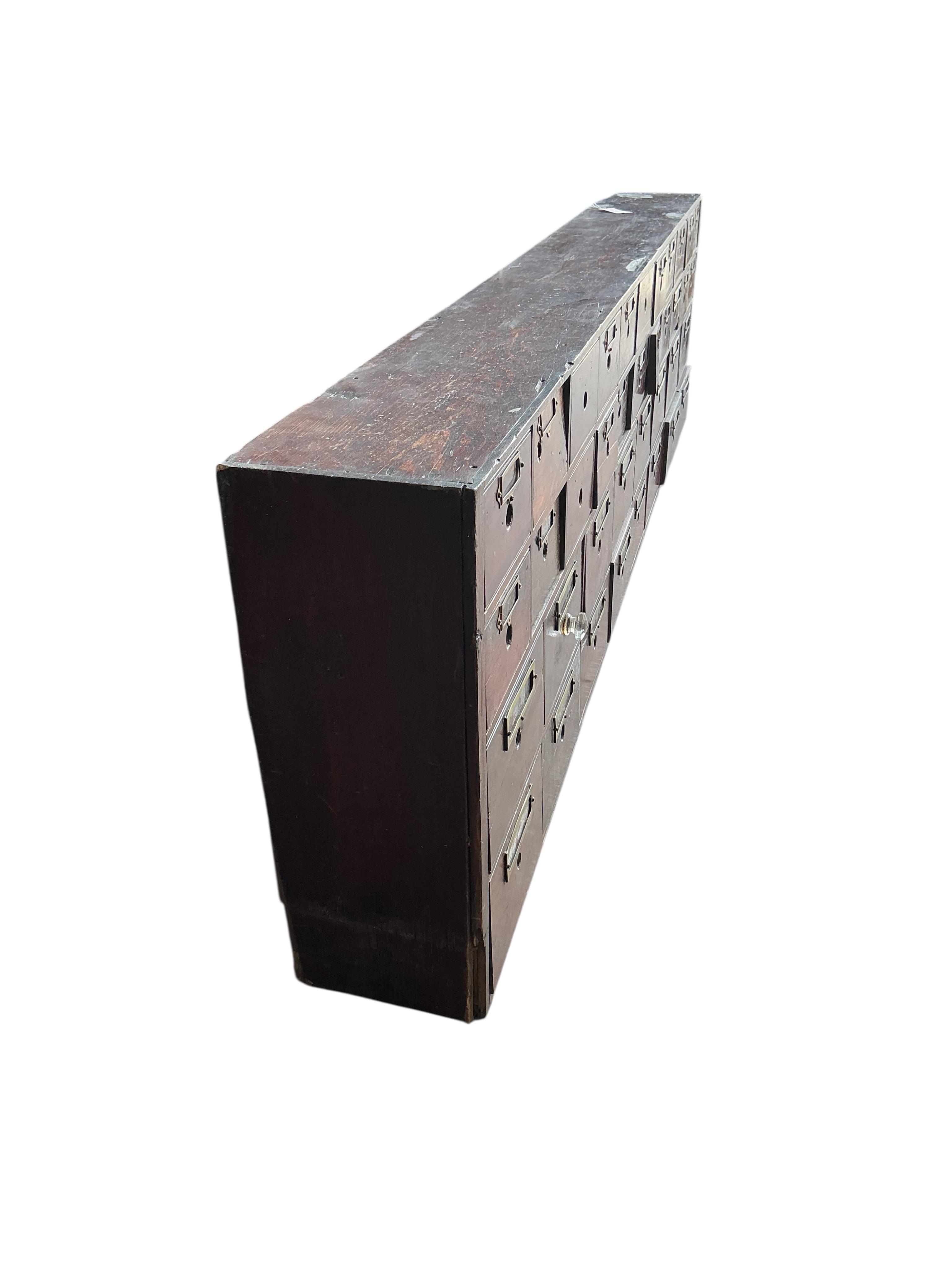 A Victorian pine and mahogany bank of apothecary drawers, width 217cm, depth 23cm, height 60cm